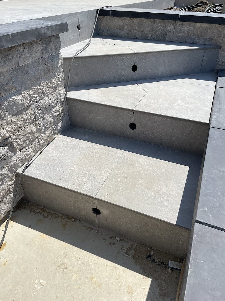 Detail of joint lines, lighting and paving of the pool steps at Aldwick Bay during construction.