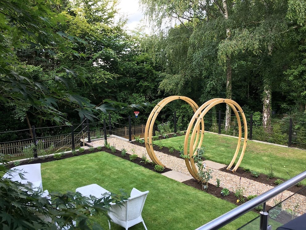 Garden flower circles built over the pathway create a focal point.