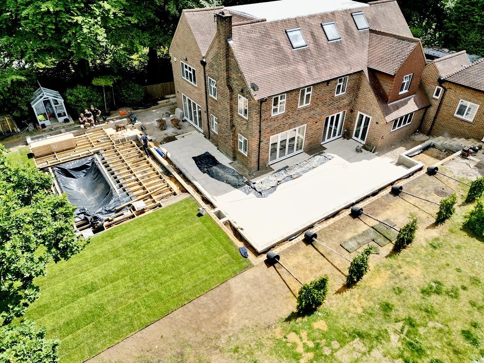 Aerial view of the patio and pool construction taken using a drone.