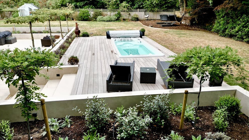 View of the completed rear pool, patio and planting.