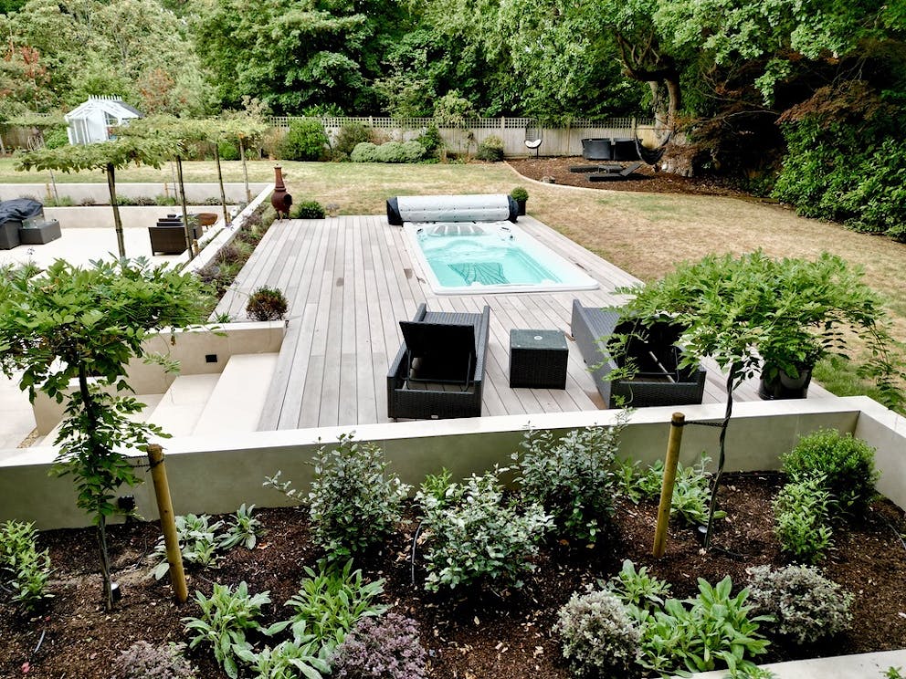 View of the completed rear pool, patio and planting.