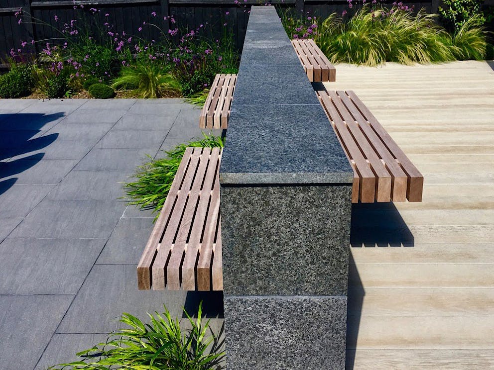 The completed stone clad wall with floating benches at Sevenoaks.